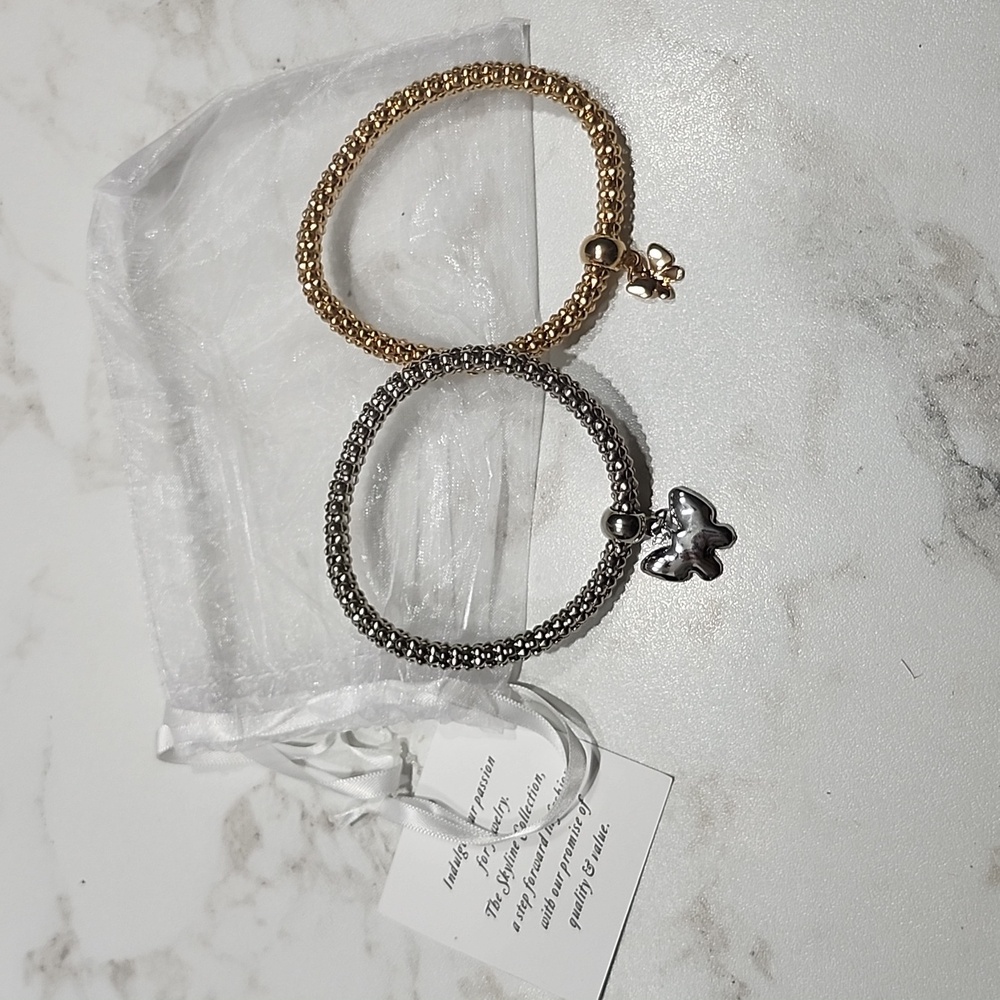 2 Braclets Silver/Gold Tone Bow Charm Bracelets